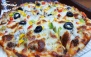 فست فود رونانی اولین مبتکر پیتزا برگر با منو باز